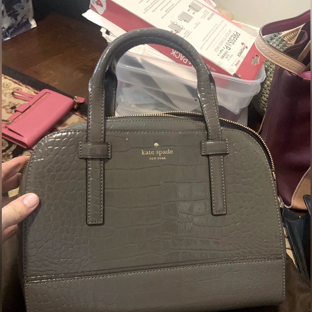 Kate spade leather grey bag.  Like new. Used once - on the real real